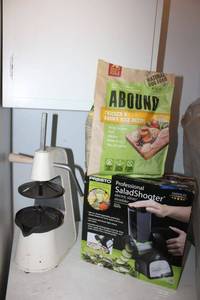lot 277 image: PRESTO Salad Shooter, Hand press Juicer, and ABOUND Natural Dog food