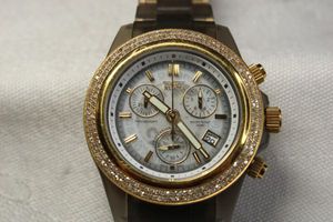 lot 3 image: Invicta diamond watch with just under 2.0 cttw diamond surround. Anatomic Swiss made. Stainless and resin band. Six jewels. Model 3122. Diamonds tested.