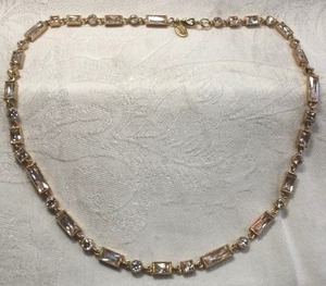 lot 258 image: Signed Nolan Miller gold plated long and short necklace. Has Nolan Miller hang tag. 18L Lobster clasp.