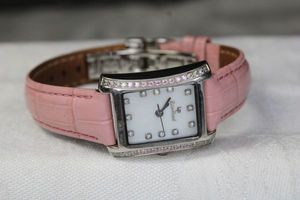 lot 8 image: Signed Lucien Piccard watch with pink leather band. Swiss made. Model 27088PK.