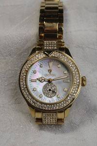 lot 14 image: Signed Croton faux diamond gold plated watch. Model CR207909