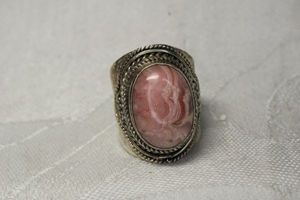 lot 18 image: Sterling Silver wide cabochon Rhodolite ring. Marked 925. Size 7.5