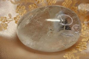 lot 23 image: Polished Quartz egg. Has cleavage. Perfect example of Hackley Fracture. Great teaching tool. With pouch