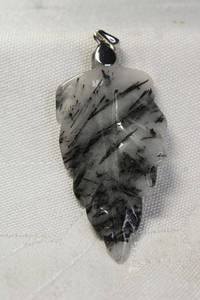 lot 25 image: Sterling Silver Rutilated Quartz pendant in carved leaf form. Marked 925 on bale.