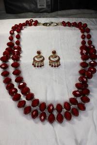 lot 27 image: Signed Kenneth Jay Lane double strand 24L red necklace with post dangle earrings. Marked KJL. Necklace has KJL moniker clasp.