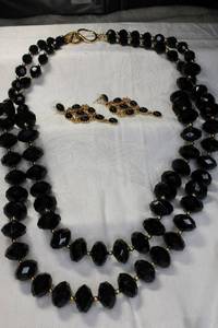lot 28 image: Signed Kenneth Jay Lane double strand 26L black necklace with post dangle earrings. Marked KJL. Necklace has KJL moniker clasp.