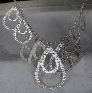 lot 40 image: Sterling Silver stamped hammered festoon necklace . 18L. Marked 925