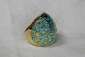 lot 55 image: Signed LGA (Lauren G Adams, Florida 1998 - QVC) blue enamel scroll gold plated heart motif statement ring. Size 8 Has comfort finish interior with filigree hearts.