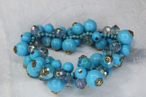 lot 56 image: Signed Joan Rivers blue bauble stretch bracelet. Has Joan Rivers hang tag.