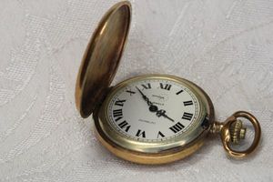lot 63 image: Arnex 17 jewel incabloc hand wind mechanical pocket watch. Hinged lid works well. Made in France. Scroll and foliate design on case.
