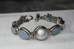 lot 68 image: Sterling Silver Blue Opal and Pearl station bracelet with toggle clasp. Marked 925. 6.75L