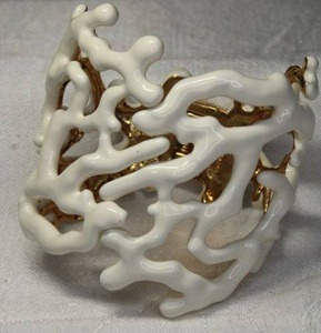 lot 78 image: Gold plated and white enamel figural coral hinged cuff bracelet. Heavy and substantial.