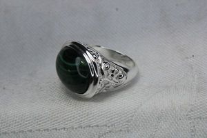 lot 80 image: Sterling Silver Malachite East-West bezel set cabochon ring. Marked RSS 925. Size 6