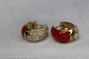 lot 81 image: Signed Joan Rivers red enamel and pave crystal hinged post earrings. Marked Joan Rivers.