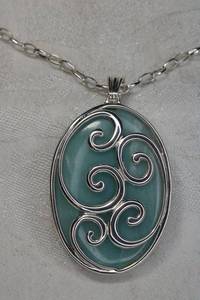 lot 90 image: Sterling Silver Italian scroll caged Larimar pendant. Marked 925 Italy on bale. 24L sterling necklace. Marked 925 on lobster clasp.