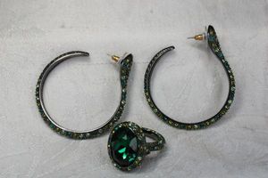lot 91 image: Signed Kenneth Jay Lane green crystal post hoop figural snake head earrings with foil back green glass ring. Size 7.5. All marked KJL.