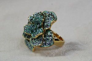 lot 92 image: Signed Joan Rivers classic blue crystal statement flower ring. Gold plated. Size 7