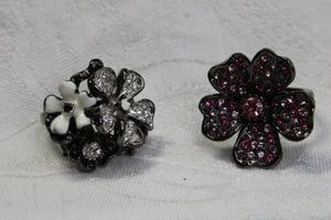 lot 94 image: (2) Signed Kenneth Jay Lane crystal rings in flower form. Both marked KJL. Size 7 and 7.5