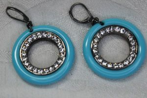 lot 95 image: Signed open disc lever back earrings. Marked KJL. 2L