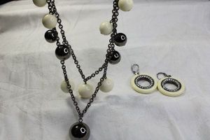 lot 98 image: Signed Kenneth Jay Lane ball bead double strand necklace with hang tag and lever back earring disc set. Marked KJL.