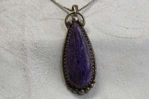 lot 99 image: Sterling Silver Charoite pendant on sterling 18L box chain. Both pieces marked 925. Pendant 2L