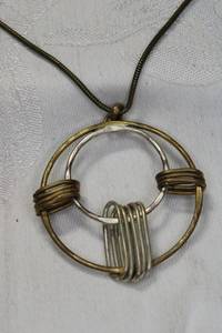 lot 103 image: Signed Baer SF (Marjorie Baer, 30 years) modernist disc pendant necklace. Has hang tag. 16L with 4 extender.