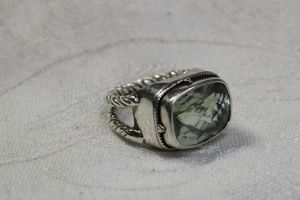 lot 105 image: Signed Lori Bonn (Calif, 1991 - ) Sterling Silver cushion cut green Quartz ring with braided split shank. Marked Lori Bonn 925. Size 7