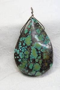 lot 112 image: Wire wrapped Turquoise pear shape pendant. 2.5L