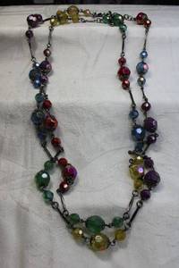 lot 115 image: Signed Joan Rivers multi color station necklace. Has Joan Rivers hang tag. 46L