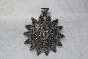 lot 119 image: Signed Merav Sterling Silver pendant with 18K gold accents and large bale. Marked Merav 925 18K 2.5W
