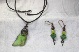 lot 166 image: Artisan crafted copper wire and Imperial Green Jasper rough specimen pendant on corded 18L necklace. Hook clasp. Pendant 2.75L Includes a pair of copper ear wire earrings 2L