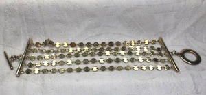lot 167 image: Multi strand flat circle disc wide bracelet with toggle clasp in gold finish. 2W