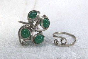 lot 171 image: Sterling Silver artisan crafted Chrysoprase ball ring, adjustable 9. Includes another wire ring Size 6.5. Unmarked.