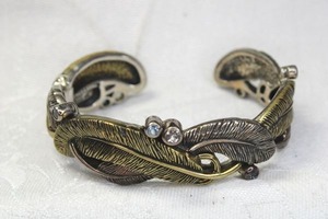 lot 182 image: Sterling Silver figural leaf form Echo The Dreamer (Margaret Thurman, QVC) bracelet with bronze accents and Blue and white Topaz gemstone accents. Marked 925 18K Dream Bronze.