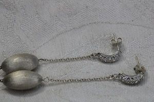 lot 122 image: Sterling Silver pave crystal tin finish poststud drop earrings. Marked 925