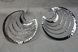 lot 123 image: Sterling Silver negative space disc post earrings. Marked 925. 2W