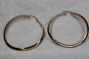 lot 128 image: Signed Milor Vicenza 2 twisted polished hoop earrings. Marked 925 Milor Italy.