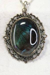 lot 132 image: Blue Morpho butterfly wing crystal pendant on 28L necklace. Pendant 2.5L