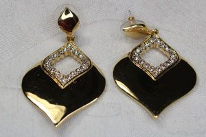 lot 134 image: Signed Nolan Miller gold plated and crystal accent post earrings. Marked Nolan Miller. 2.25L