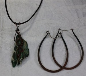 lot 137 image: Artisan crafted copper wire and Imperial Green Jasper rough specimen pendant on corded 18L necklace. Hook clasp. Pendant 2.75L Includes a pair of copper ear wire earrings 3.25L