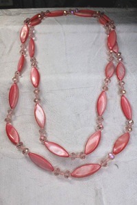 lot 147 image: Dyed pink shell and faceted glass bead continuous necklace. 48L