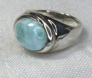 lot 155 image: Sterling Silver Larimar East-West ring. Marked 925. Size 7. Note Has white veining that may be natural or a crack.