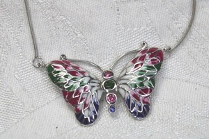 lot 156 image: Sterling Silver snake chain necklace with incorporated enamel butterfly pendant. Both marked 925. 16L