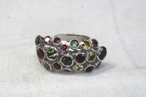 lot 157 image: White metal gemstone ring. Unmarked. Amethyst, Peridot, Citrine tested. Size 7. Unmarked.
