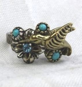 lot 161 image: Signed Fritz Sterling Silver, Turquoise and Blue Topaz figural bird ring with ribbed shank. Marked 925. Size 7