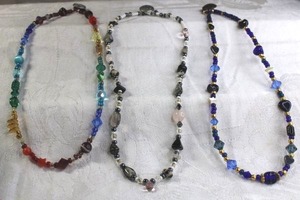 lot 194 image: Glass jewelry selection. Includes (3) artisan crafted glass station bead necklaces with button clasps.