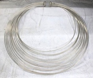 lot 196 image: Sterling Silver multi-strand tension omega choker with pouch and box. No markings