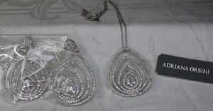 lot 203 image: Adriana Orsini  Nieman Marcus rhodium plated pave crystal teardrop pendant necklace and post earring set. 18L Earrings 2L