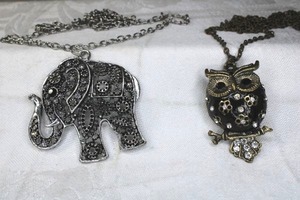 lot 201 image: Articulated owl pendant with moving tail feather necklace 32L and elephant pendant necklace 30L