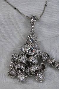 lot 202 image: Signed Nolan Miller pave crystal dangle pendant AB necklace. Has Nolan Miller hang tag. 40L Lobster clasp. Pendant 2.25L